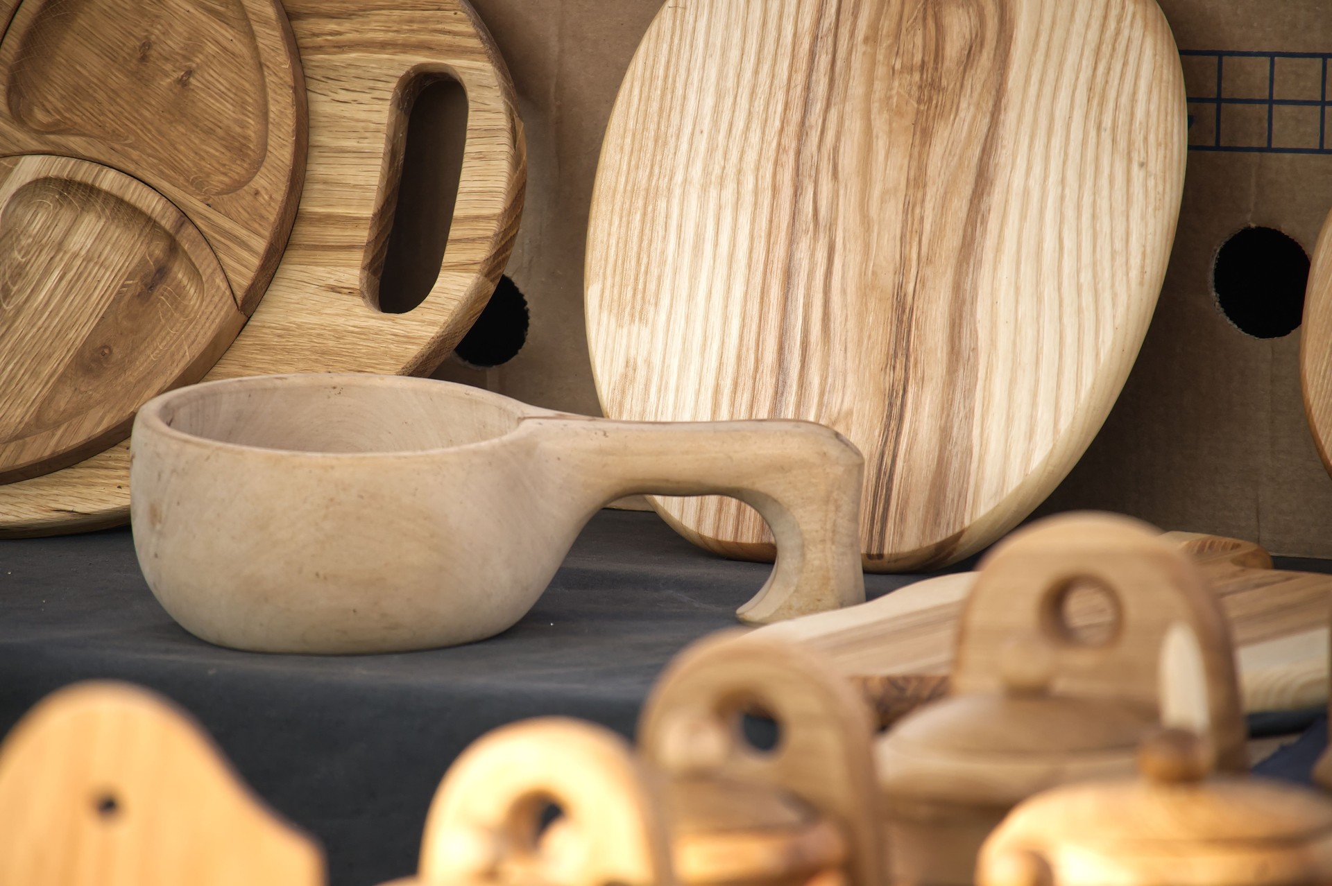Selection of handcrafted wooden kitchenware displays natural textures and unique craftsmanship.